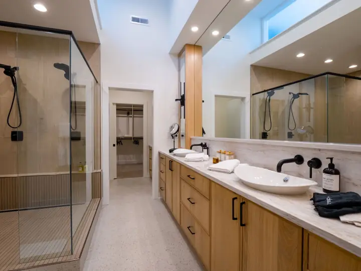 Bathroom with double vanity and glass shower