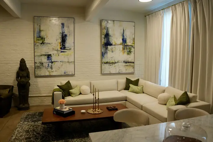Living room with sectional and artwork