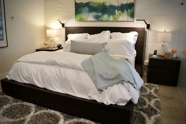 Made bed with throw blanket